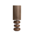 Dan 3 table lamp with three rounded brown wood-grain forms and a tall earthy cylindrical shade